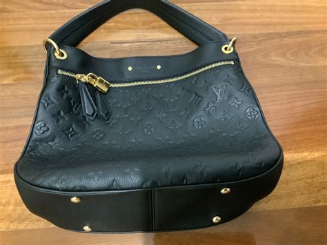 LOUIS VUITTON Spontini Empreinte Leather .